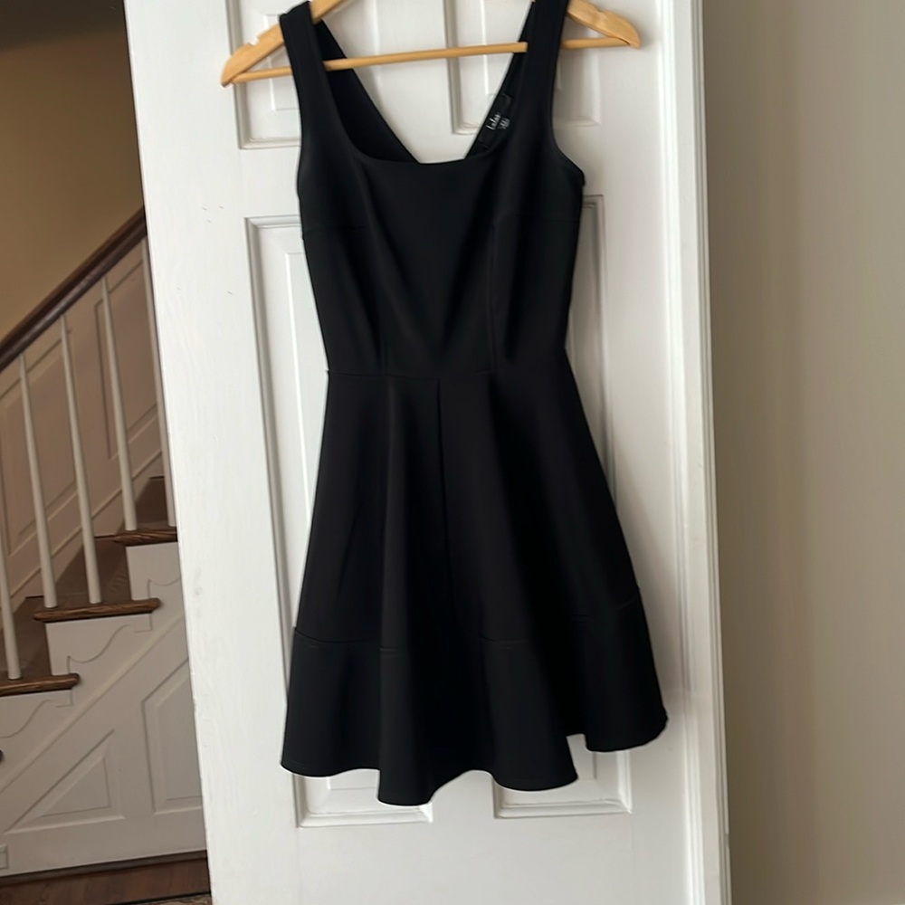 Lulus black skater dress with exposed zipper detail.